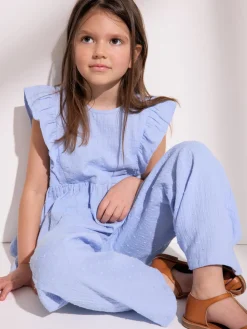 Vävd blus med volanger prickig